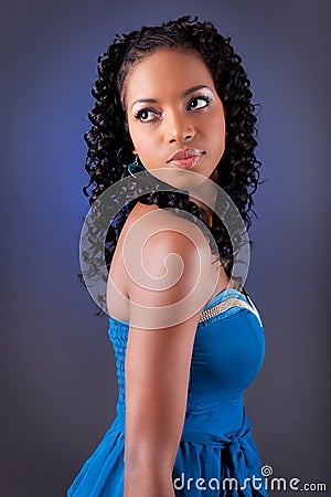 Young beautiful african woman in blue dress