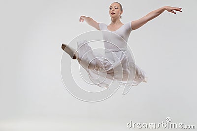 Young and beautiful ballet dancer posing isolated