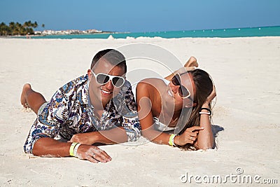 Young beautiful couple enjoying the sunset in luxury resort