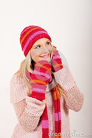 Young beautiful winter girl with pink gloves