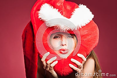 Young beautiful woman with big red heart