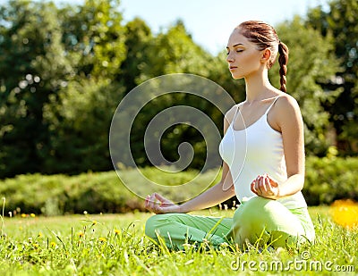 Young and beautiful woman doing yoga exercises .Yoga background