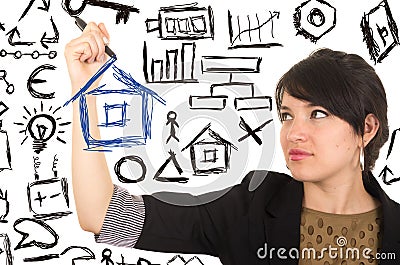 Young beautiful woman drawing a house with marker
