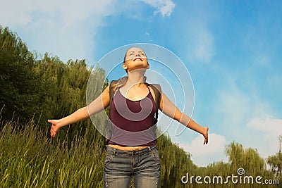 Young beautiful woman enjoying life. Freedom concept of happines