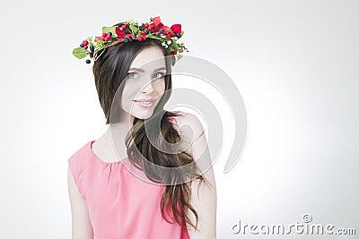 Young beautiful woman with flower wreath on head