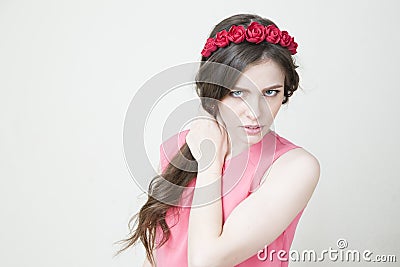 Young beautiful woman with flower wreath on head