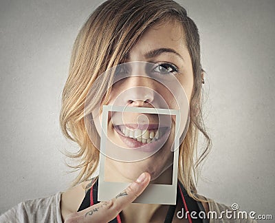 Young beautiful woman with a pic of her smile