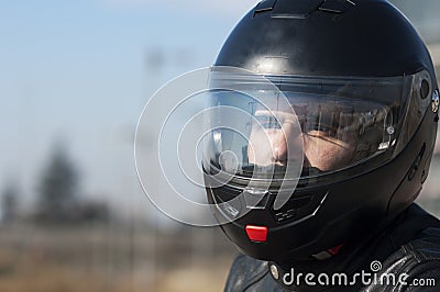 Young biker with helmet