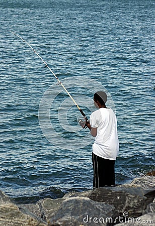 Young black man fishing