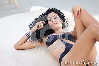 Young black woman, afro hairstyle, wearing bikini