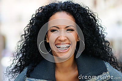 Young black woman smiling with braces