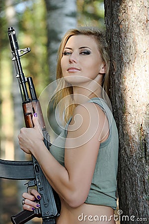 Young blonde with a rifle