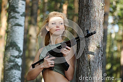 Young blonde with a rifle