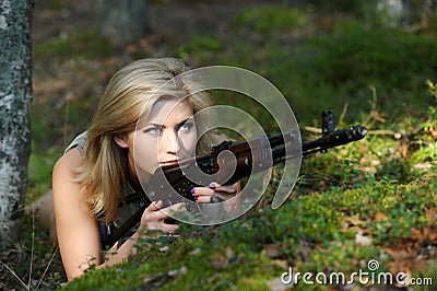Young blonde with a rifle