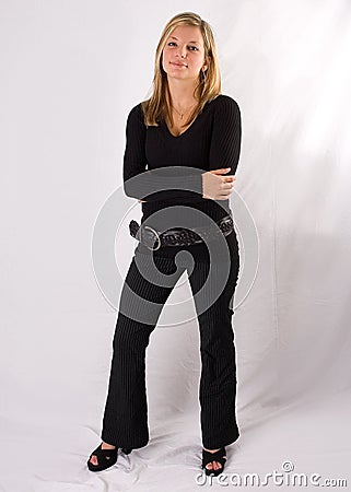 Young blonde woman full-length portrait black outfit