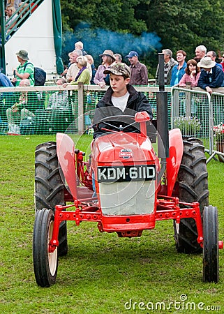 Young Boy driving old Tractor