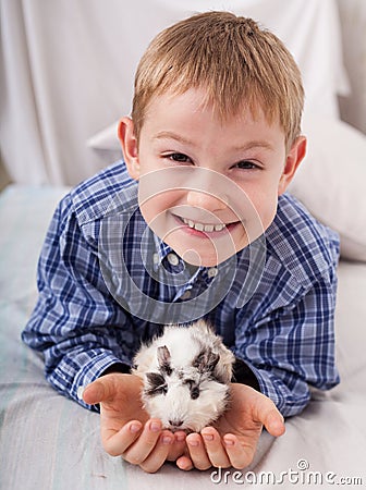 Young boy with guinea pig