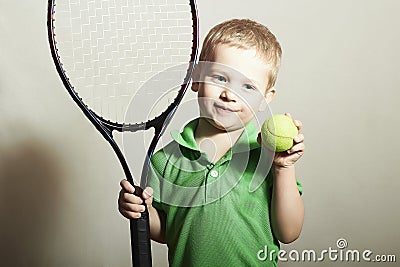 Young Boy Playing Tennis. Sport Children. Child with Tennis Racket and Ball