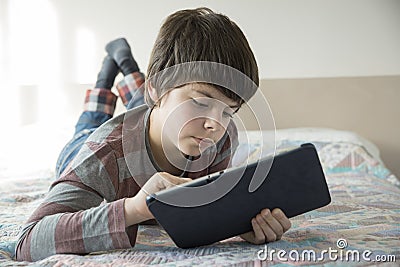Young boy and a tablet digital