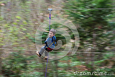 Young boy on zip line