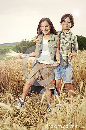 Young boys having fun in the wheat field