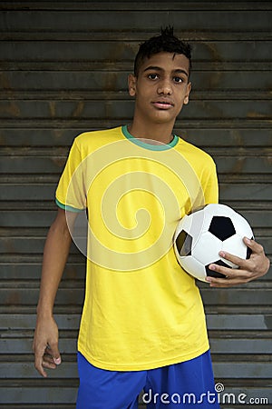 Young Brazilian Football Player Holding Soccer Ball