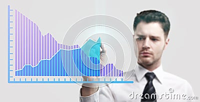 Young business man drawing a rise graph