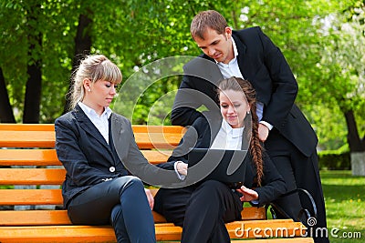 Young business people with laptop