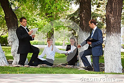 Young business people in a park