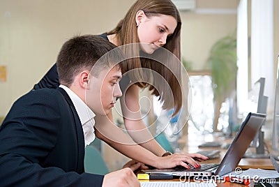 Young business people work in a computer class