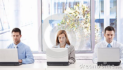 Young businesspeople sitting in meeting room