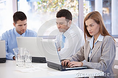 Young businesspeople working in meeting room