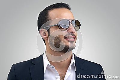 Young Caucasian man wearing sunglasses posing