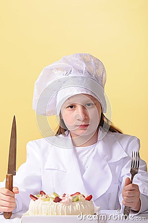 Young chef with cake