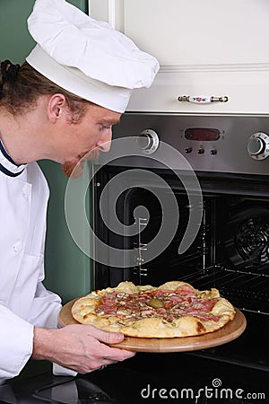 Young chef with italian pizza