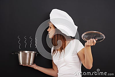 Young chef with pot