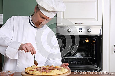 Young chef prepared italian pizza