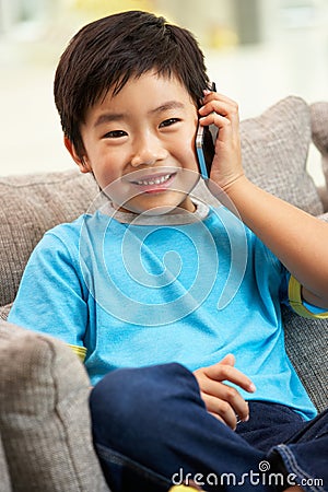 Young Chinese Boy Using Mobile Phone