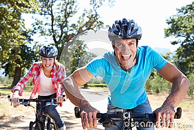 Young couple on bike ride through country