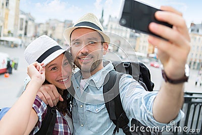 Young couple on holidays taking selfie