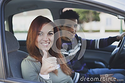 Young couple inside the car