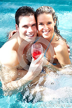 Young couple in jacuzzi.