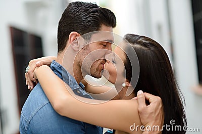 Young couple kissing in the street