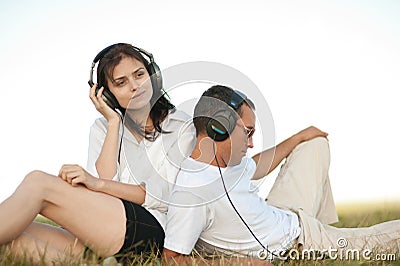 Young couple listening to music