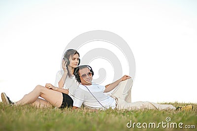 Young couple listening to music