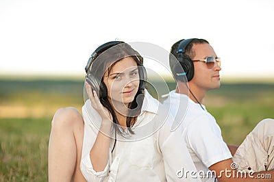 Young couple listening to music