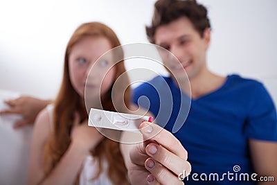 Young couple with negative pregnancy test