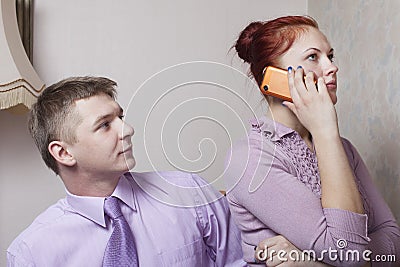 Young couple and phone.