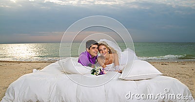 Young couple resting in bed