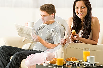http://thumbs.dreamstime.com/x/young-couple-spending-morning-time-together-eating-reading-31443215.jpg